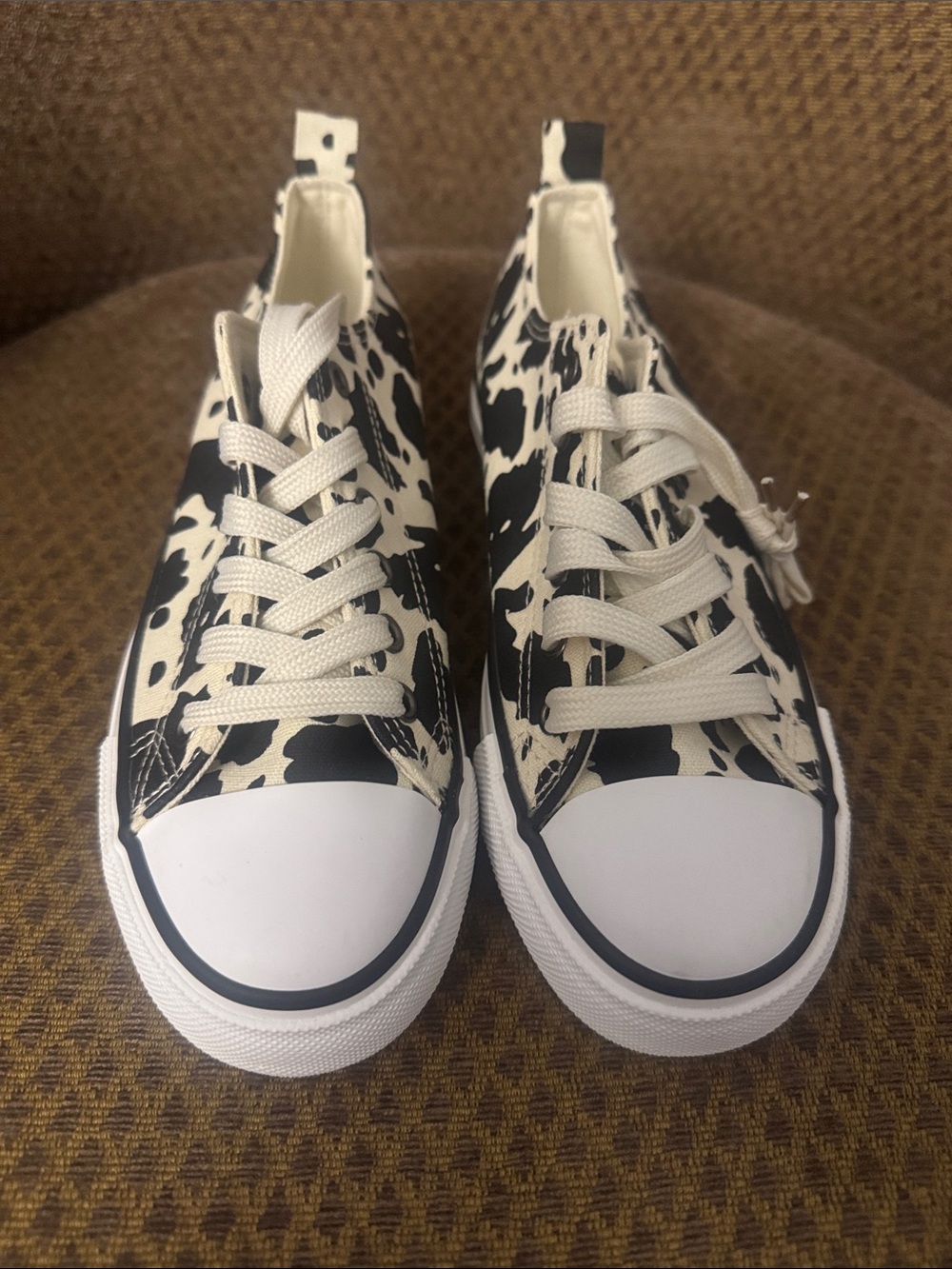 Olivia Miller Black & White Cow-Print Women’s Sneakers